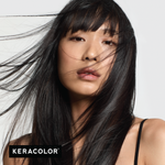 Woman with long black hair blowing in the wind, with Keracolor logo.