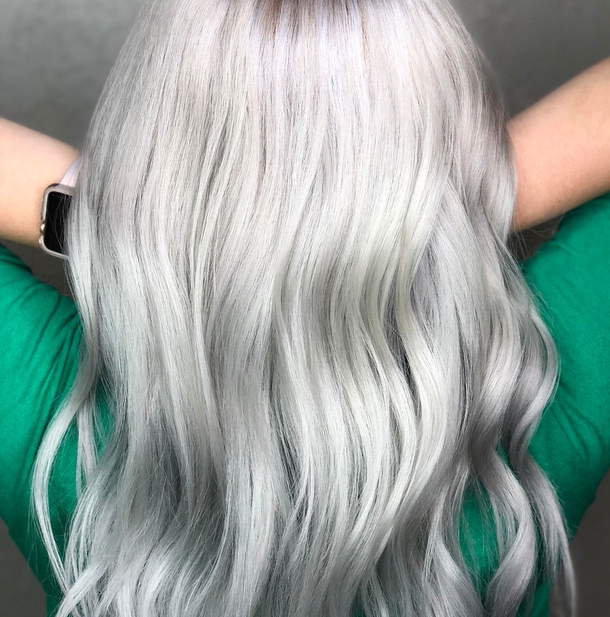 A candid image of a women with bleached hair treated with Violet toning drops